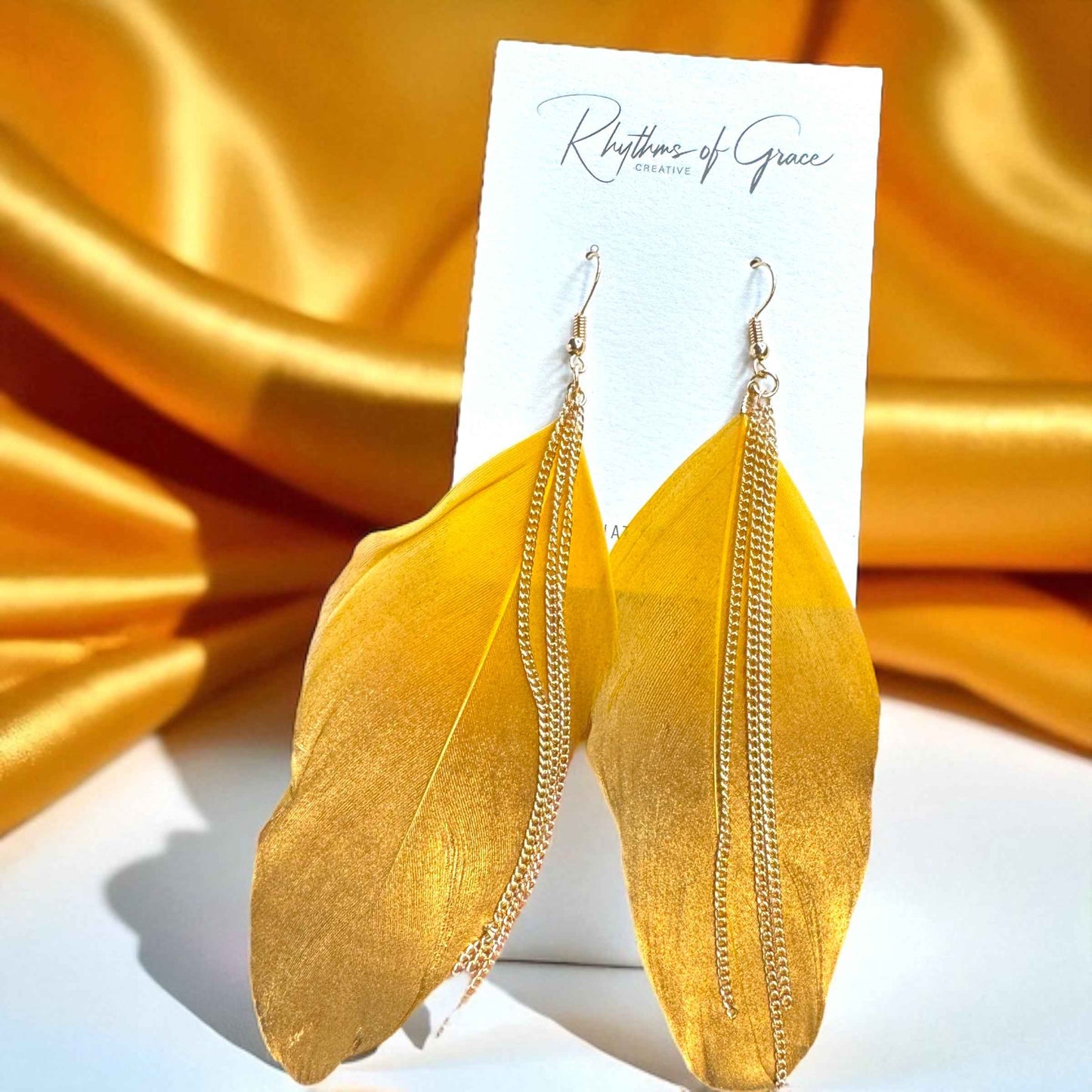 Gold Dipped Feather Earrings: Dance Into the Festivity!