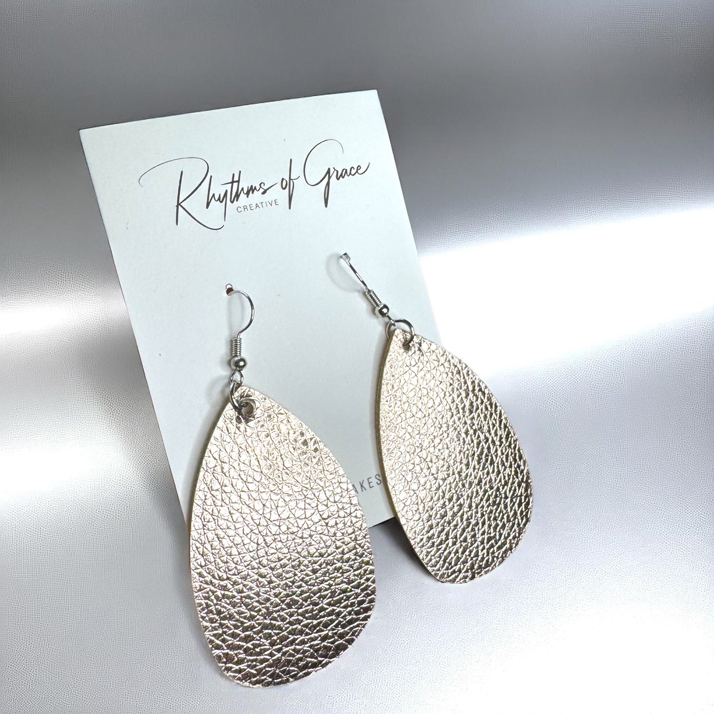 Sparkle & Shine: Metallic Teardrop Faux Leather Earrings! 🌟