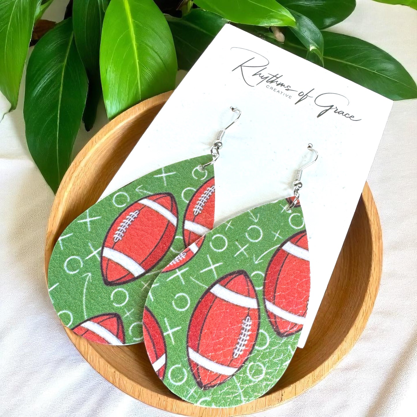 Touchdown Style: Football Playbook Dangle Earrings 🏈