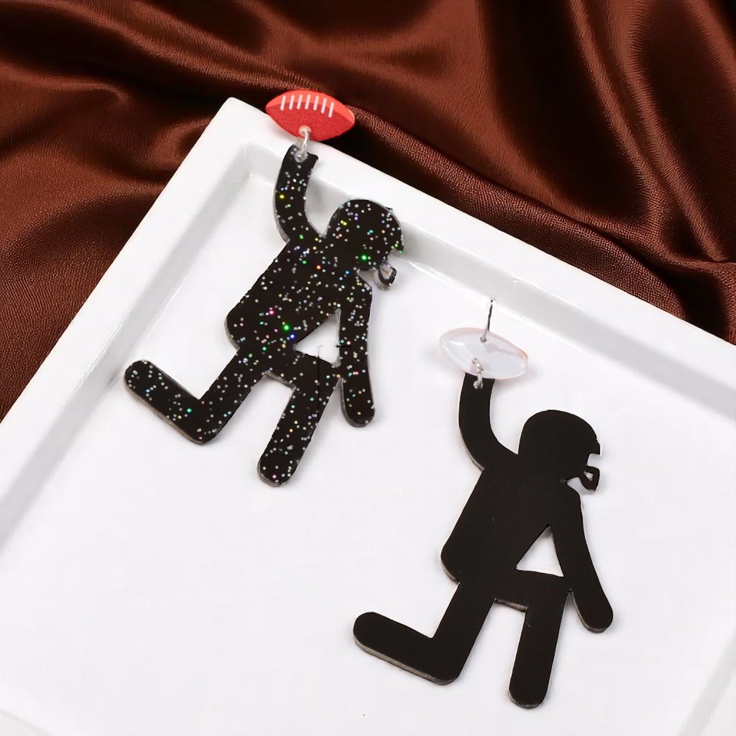 Touchdown Style: Football Player Dangle Earrings 🏈