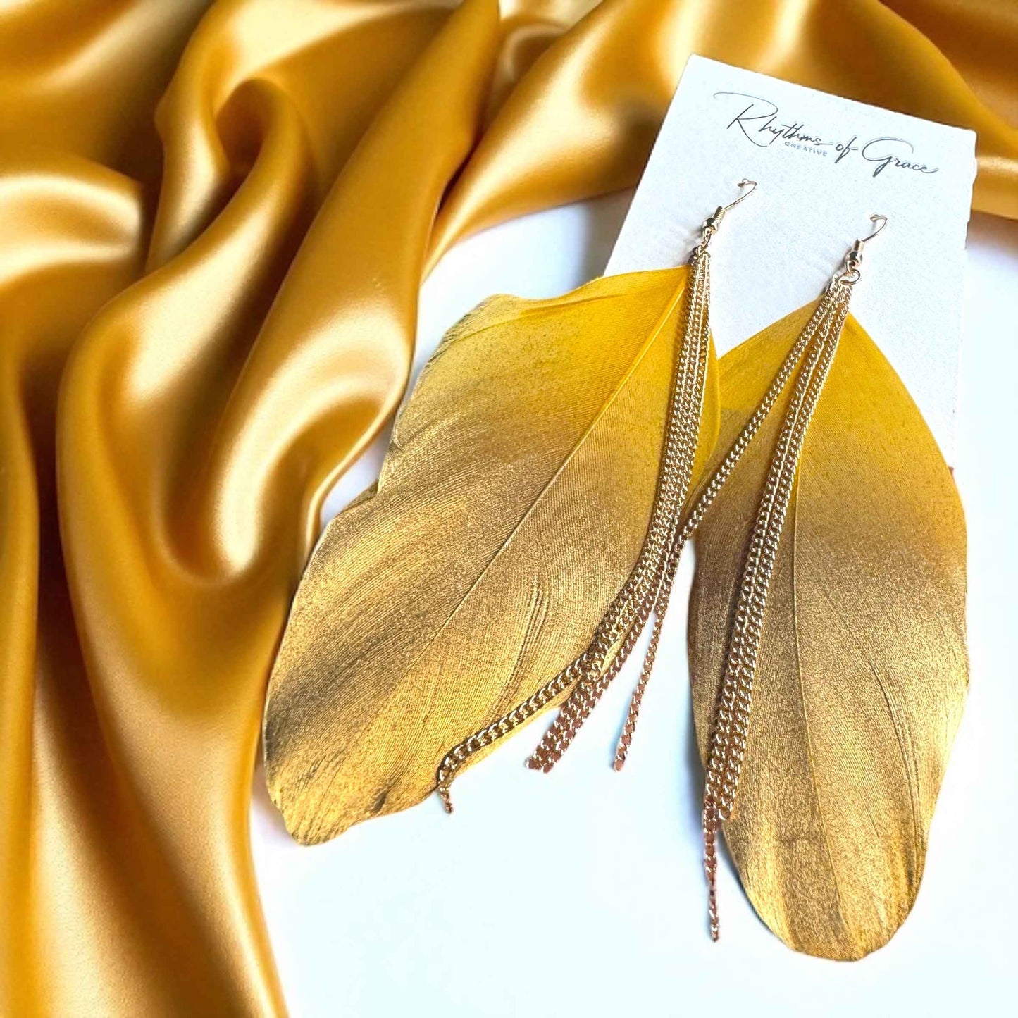Gold Dipped Feather Earrings: Dance Into the Festivity!