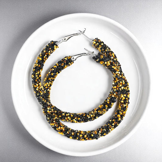 Shimmering Elegance: Black and Gold Glitter Hoops