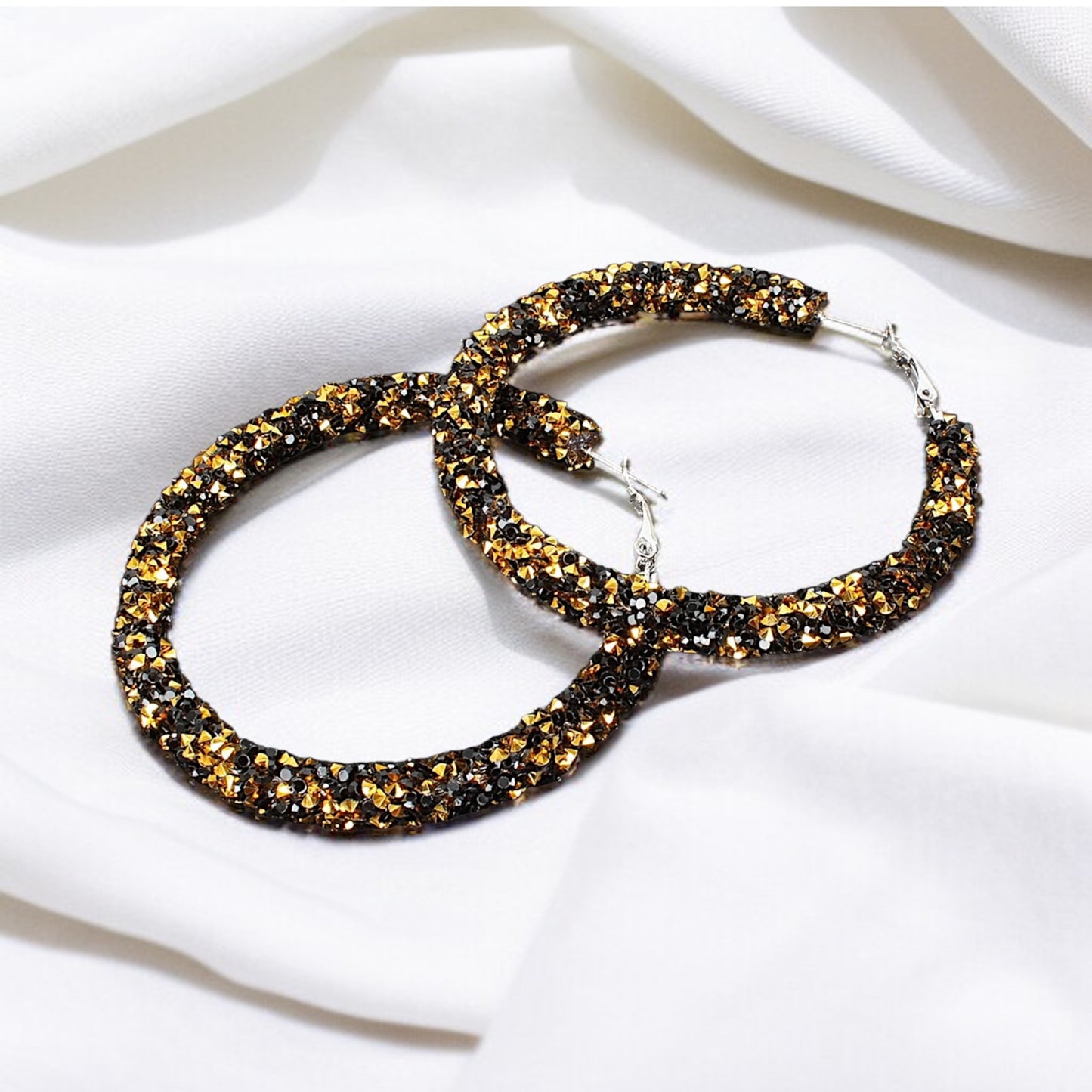 Shimmering Elegance: Black and Gold Glitter Hoops