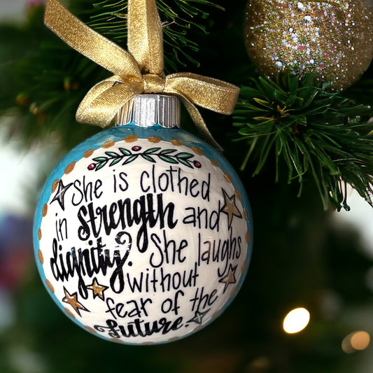 Christmas Ornament: “She is clothed in strength and dignity. She laughs without fear of the future.”