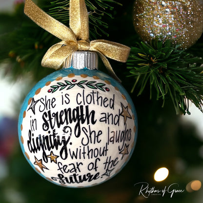 Christmas Ornament: “She is clothed in strength and dignity. She laughs without fear of the future.”