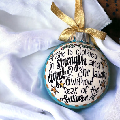 Christmas Ornament: “She is clothed in strength and dignity. She laughs without fear of the future.”