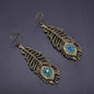 Feathered Sparkle: Stunning Peacock Dangle Earrings – Flutter into Style!