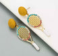 Sparkle on the Court with Our Rhinestone Tennis Racket Dangle Earrings! 🎾